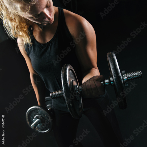 Strong Blonde Woman Lifting Weight