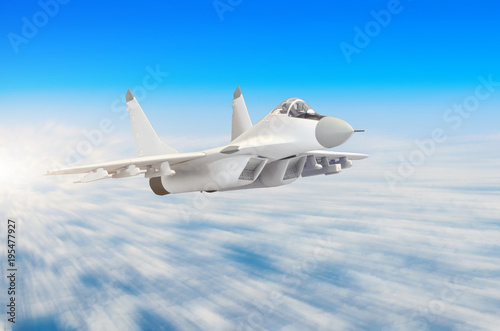 Military fighter aircraft at high speed, flying high in the sky.