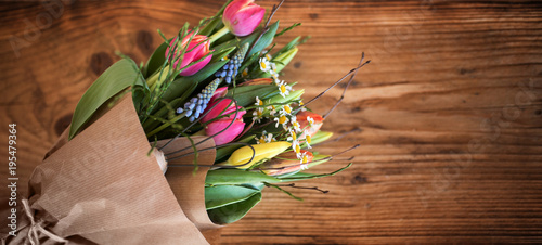 Fototapeta Naklejka Na Ścianę i Meble -  Colorful spring bouquet on dark rustic wood