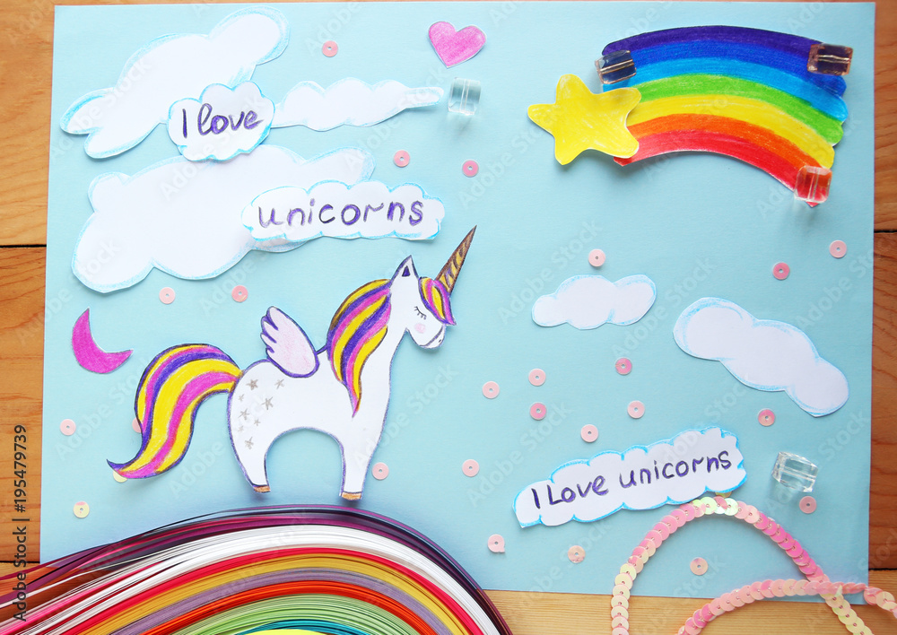 applique with a picture of a unicorn and a rainbow on a wooden background.I love unicorns applique with a picture of a unicorn and a rainbow on a wooden background.I love unicorns