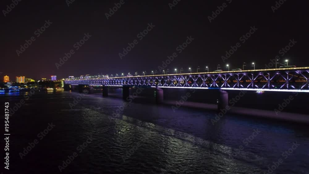 WUHAN, CHINA - MAY 2, 2017: night time illuminated cityscape qingchuan bridge aerial drone WUHAN, CHINA - MAY 2, 2017: night time illuminated cityscape qingchuan bridge aerial drone