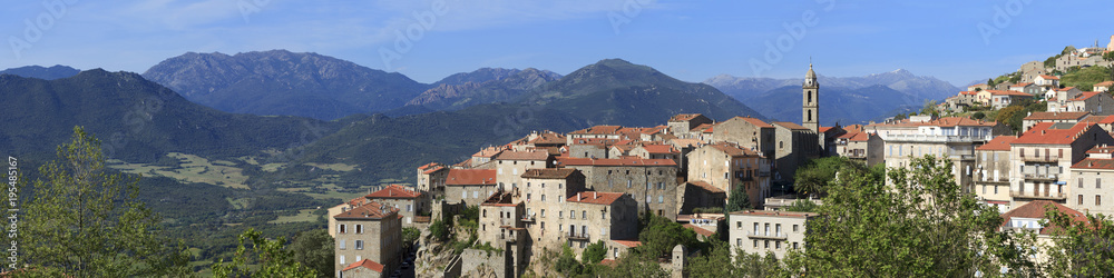 Sartene, panoramic view of town with mountains behind, Corsica, France Sartene, panoramic view of town with mountains behind, Corsica, France