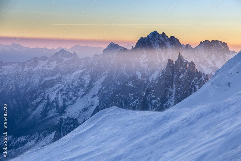 Panoramic view on rocky peaks of Aiguille du Midi at the sunrise