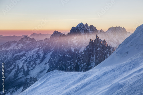 Panoramic view on rocky peaks of Aiguille du Midi at the sunrise