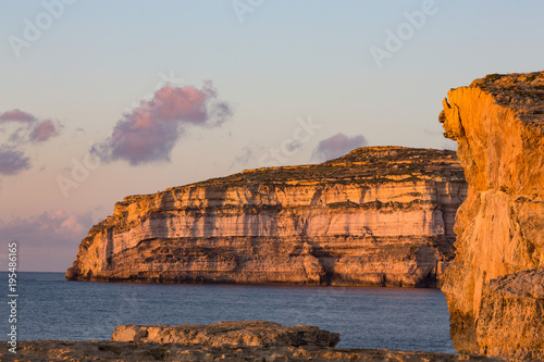 Dwejra Bay on the rugged Gozo coast in evening light, site of the fallen Azure Window, Gozo, Malta, Mediterranean photo