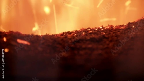 Burning Sawdust in the furnace close up. Fire inside of furnace of boiler. Alternative fuel.
