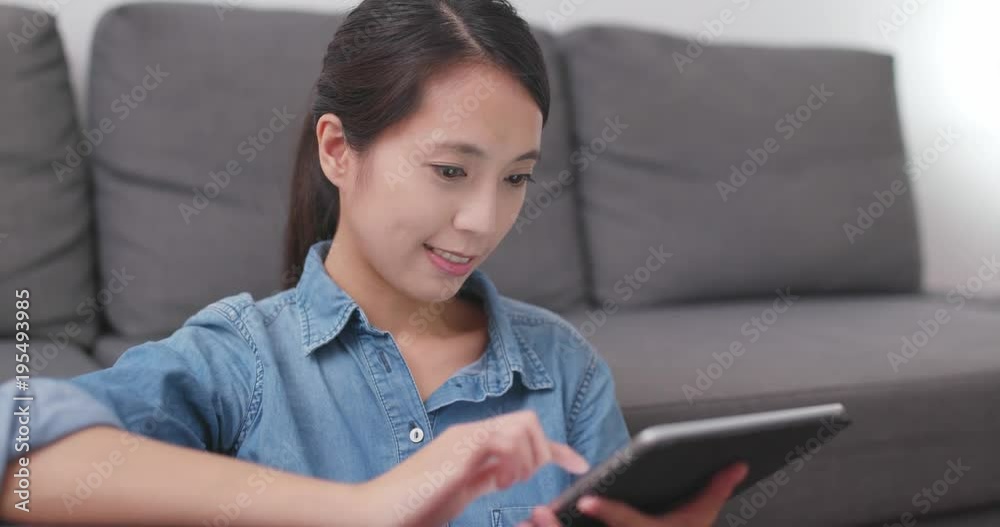 Woman use of digital tablet computer at home Woman use of digital tablet computer at home