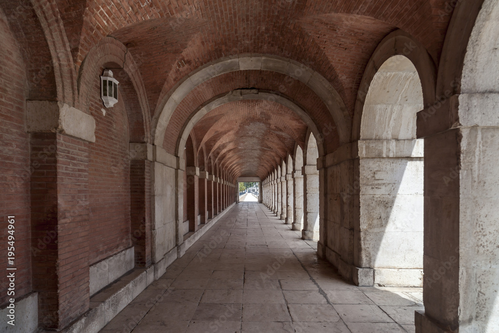 Arcade passageway near to palace of Aranjuez, province Madrid, Spain.