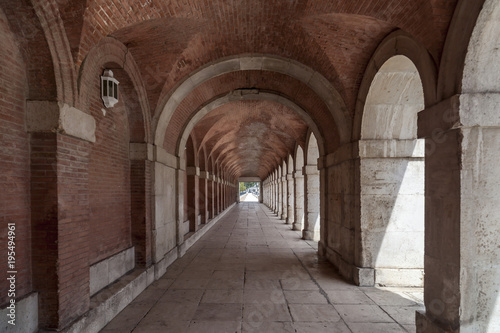 Arcade passageway near to palace of Aranjuez, province Madrid, Spain.