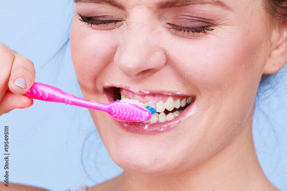 Woman brushing cleaning teeth Woman brushing cleaning teeth