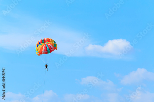 Man playing parasailing.
