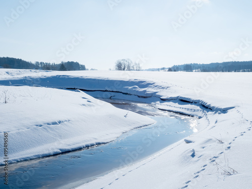 Creek landscape with snow and frost