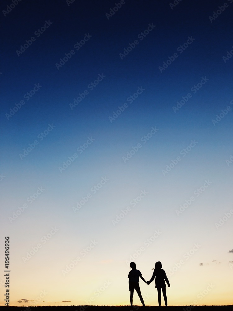 Two girls holding hands