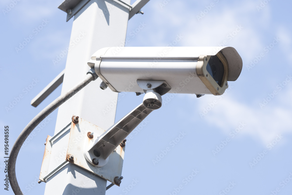 security cameras in garden on blue sky background security cameras in garden on blue sky background