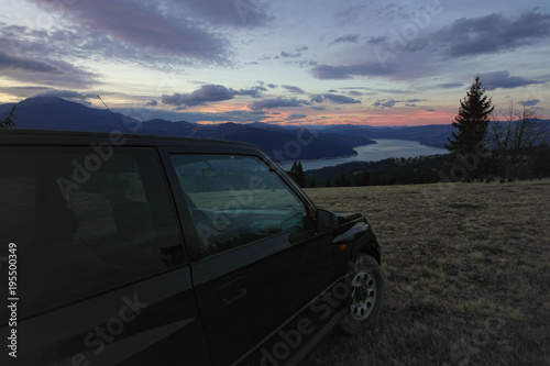 off road car in the mountain landscape and lake © Ioan Panaite