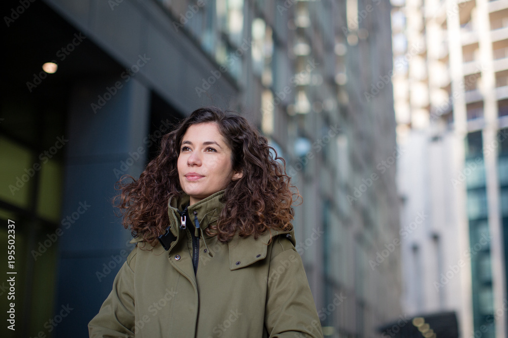 Young adult female walking in city Young adult female walking in city