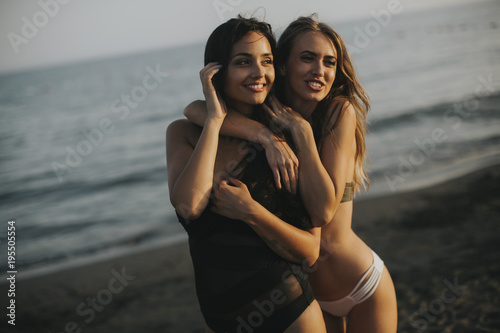Young women having fun on the beach