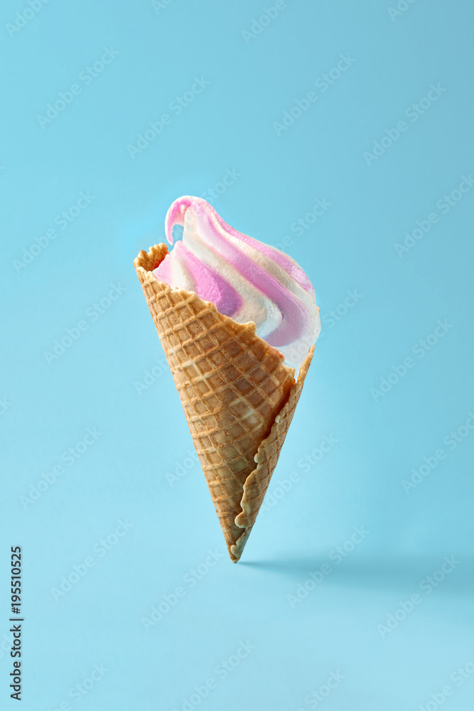 Ice cream in waffle cup, white and purple on light blue background. Ice cream in waffle cup, white and purple on light blue background.