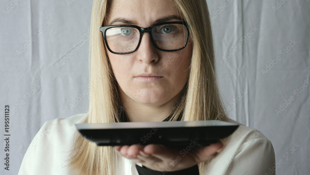 Beautiful green eye of a girl, blonde, freckles, with glasses, works in a tablet. Beautiful green eye of a girl, blonde, freckles, with glasses, works in a tablet.