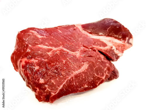Different, alternative steaks of marbled beef on white background with shadow.
