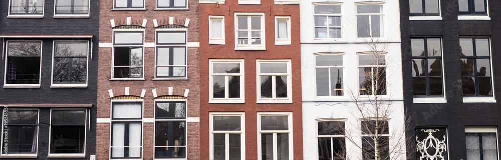Traditional color contrasted dutch buildings in Amsterdam Traditional color contrasted dutch buildings in Amsterdam