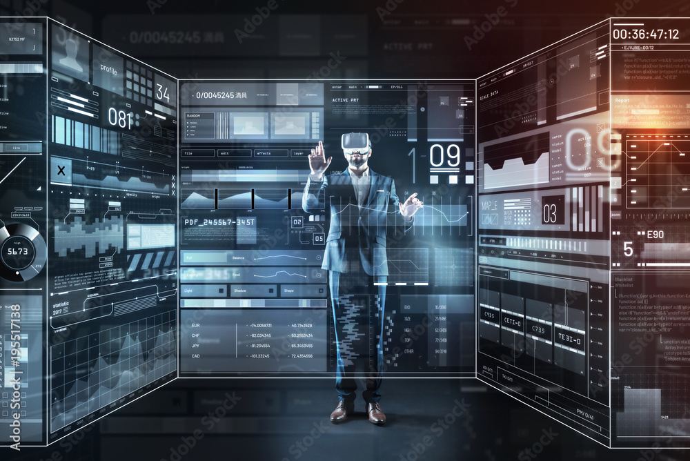 Convenient gadget. Calm clever attentive programmer using virtual reality while carefully working at his new program