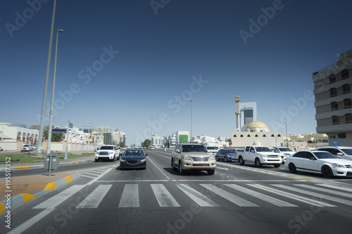 Cars stand on the light. Difficult traffic on the road. Abu Dhabi UAE
