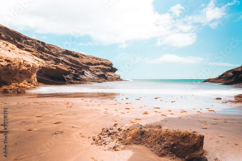 Desert beach with rocks and clear blue sky © Oliver Montesino