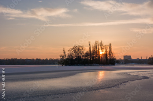 An Island  a Frozen Lake and a Beautiful Sunset