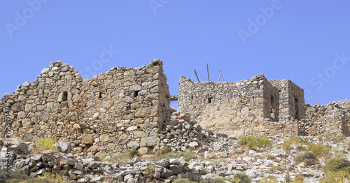 Ruins of ancient Venetian windmills built in 15th century, Lassithi Plateau, Crete, Greece.  Most typical characteristic of the Plateau. In the past, they numbered thousands making up a magnificent la © VP