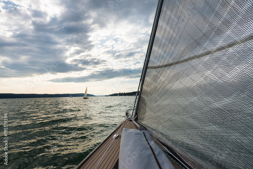 Sailing boat on the Lake of Constance with further boats in the background photo