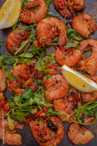 Large grilled BBQ shrimp with sweet chili sauce, green onion and lemon.