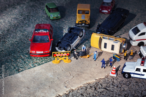 Scene of cars (miniature, toy model ) accident on street.Insurance / terrorism concept.