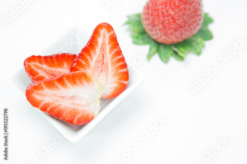 Fresh strawberry in white small dish on white background, Isolated.
