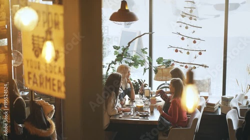 group of a young women in the cafe