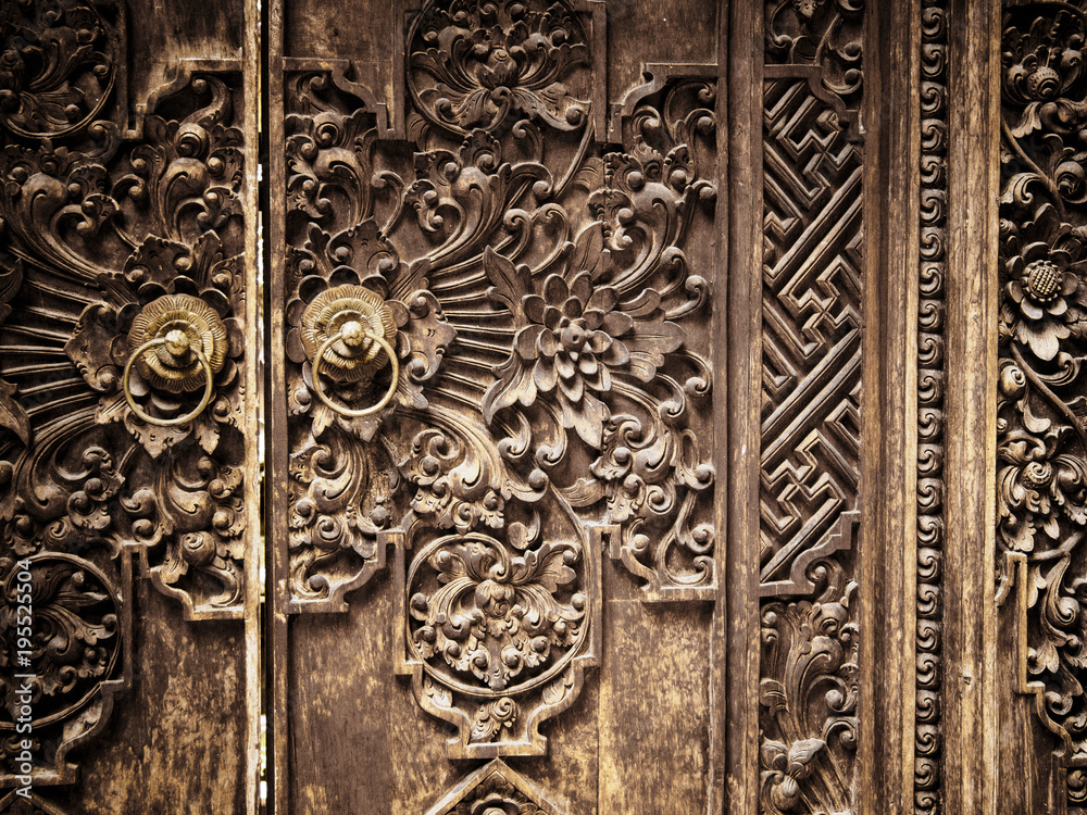 Carved Wooden Door with Floral and Geometric Designs. Ubud, Bali, Indonesia. December 2015