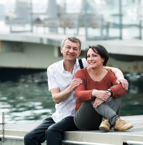 Positive couple in love posing outdoors