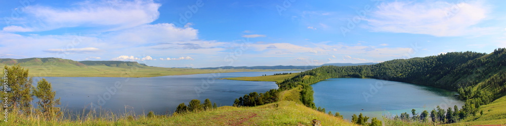 awesome wide angle panoramic view to summer landscape in republic of Khakassia, Siberia with two deep lake in mountain countryside. Lakes of tectonic origin