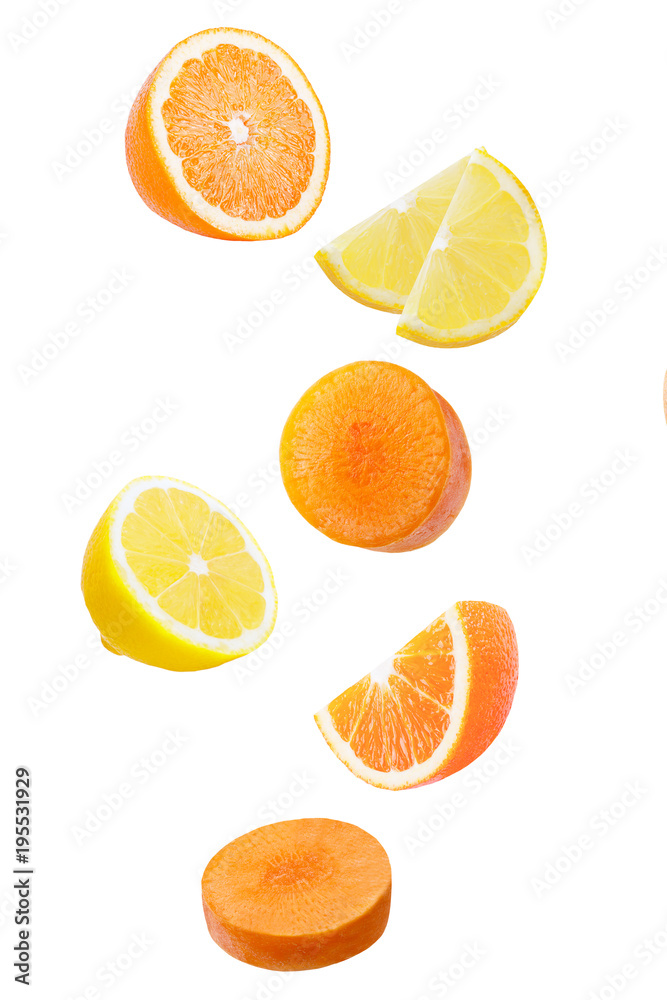 Falling orange, limon and carrot isolated on white Falling orange, limon and carrot isolated on white