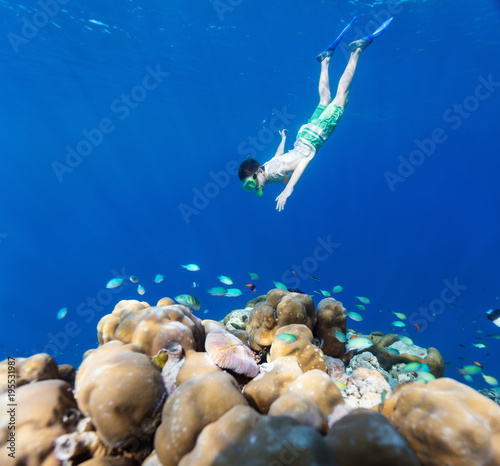 Boy swimming underwater