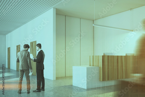 White and wooden office, reception side people © ImageFlow