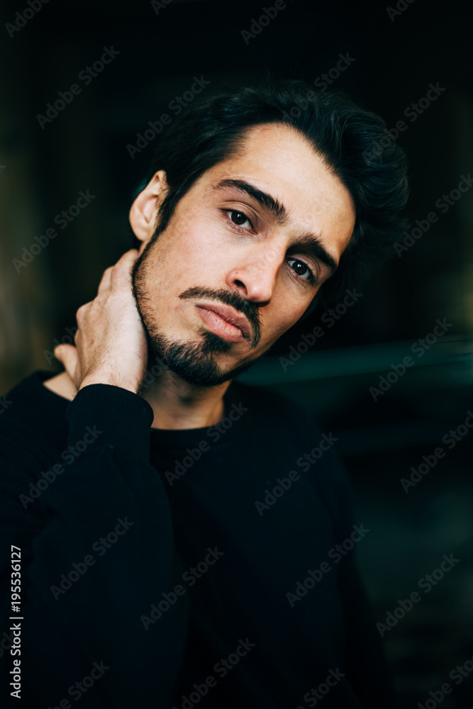 Fototapeta premium Sad and depressed Mediterranean looking young man