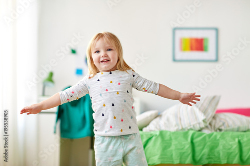 happy little girl having fun at home