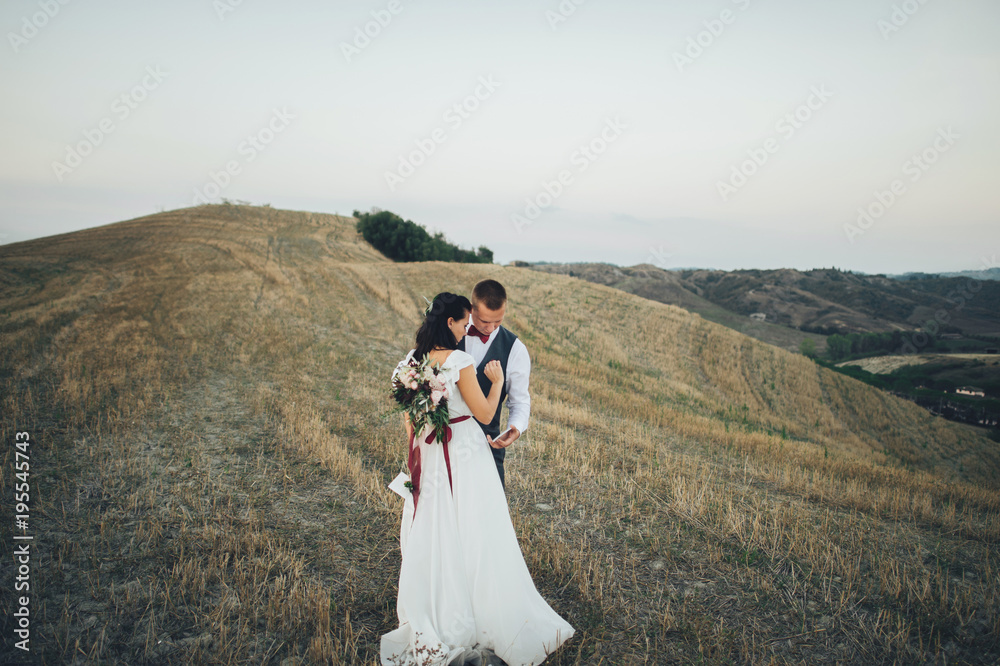 Young couple kissing in Tuscany, Italy