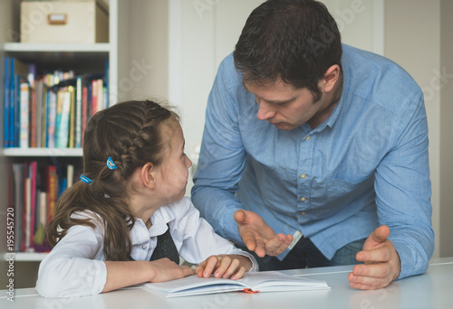Father argues with his daughter about book facts.