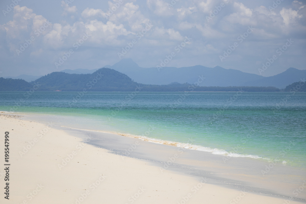 Beautiful color of sea with clouds in the nature background white sand beach at Southern of Thailand