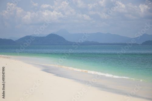 Fototapeta Naklejka Na Ścianę i Meble -  Beautiful color of sea with clouds in the nature background white sand beach at Southern of Thailand