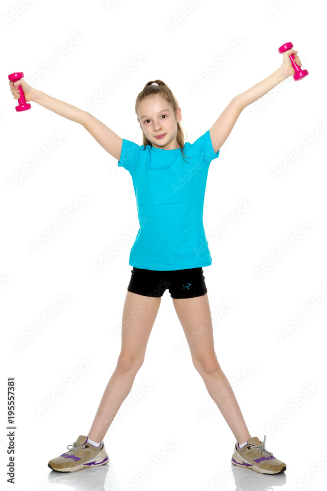 Little girl doing exercises with dumbbells. Little girl doing exercises with dumbbells.