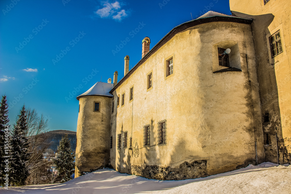 Old castle facade in winter time in small slovakian city Zvolen