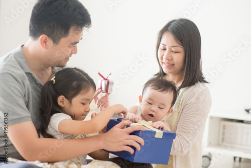 Happy Asian Family and gift box © WONG SZE FEI